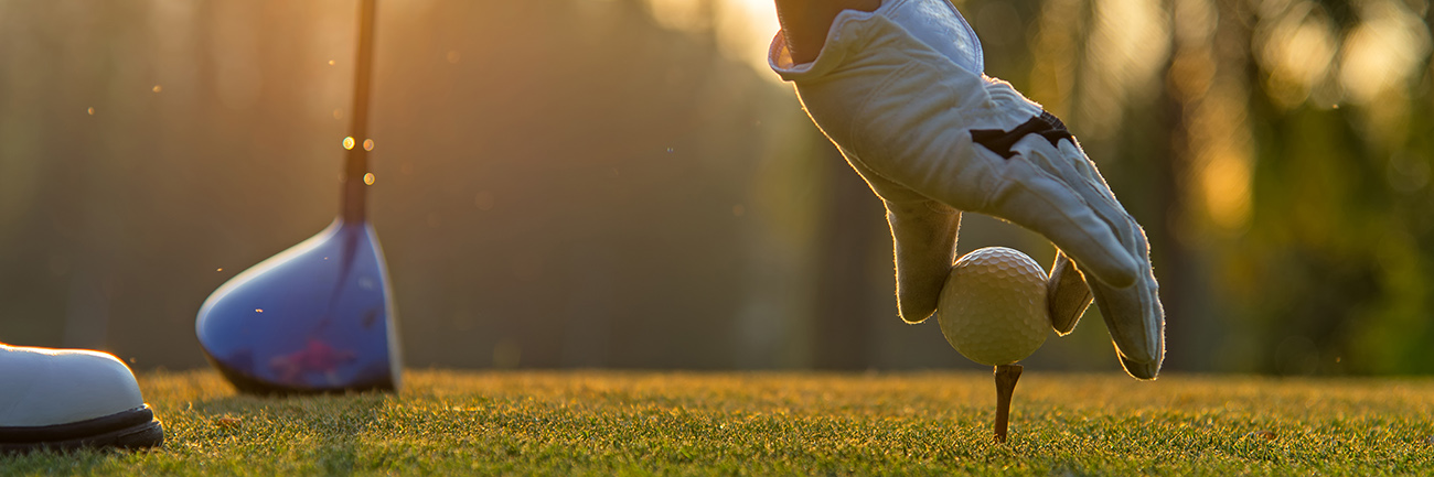 Putting a golf ball on a tee